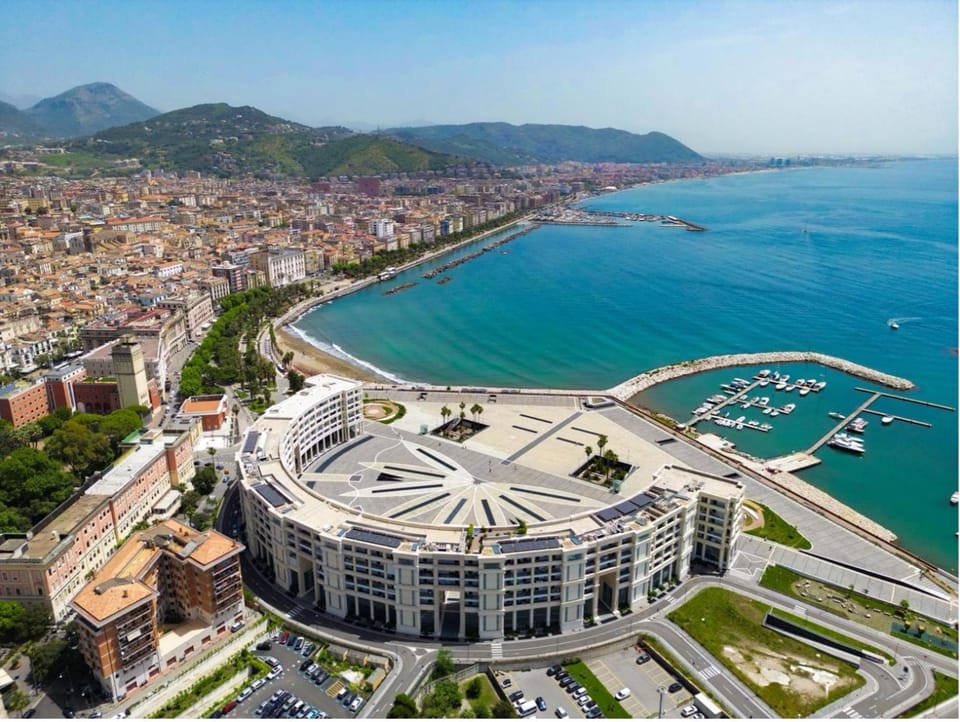 Property building, Nearby landmark, Day, Natural landscape, Beach, City view, Sea view, Location
