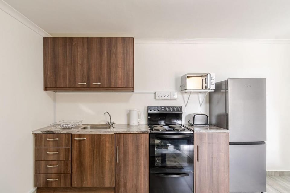 Kitchen or kitchenette, oven, stove, toaster