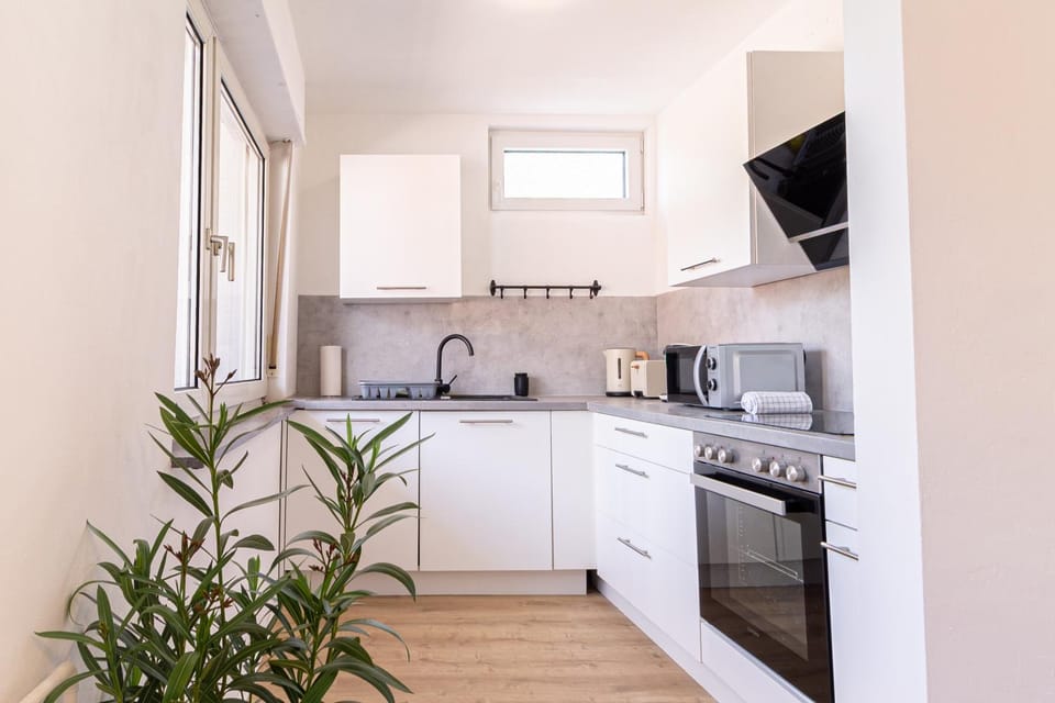 Kitchen or kitchenette, dishwasher, microwave, oven, stove, toaster