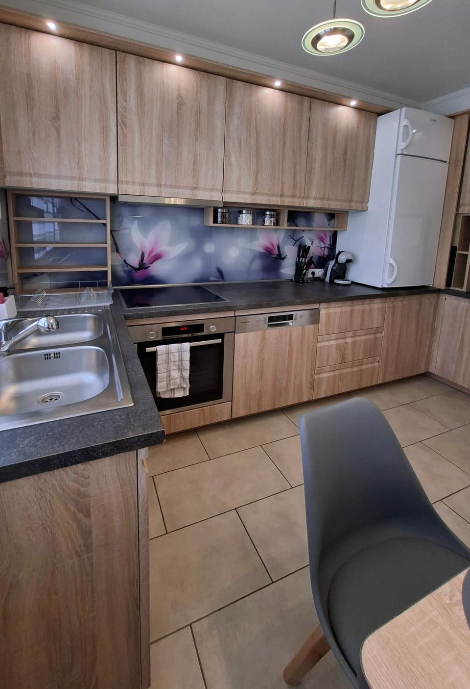 Kitchen or kitchenette, dishwasher, oven, stove
