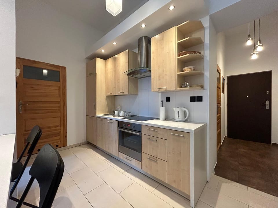 Kitchen or kitchenette, dishwasher, oven, stove