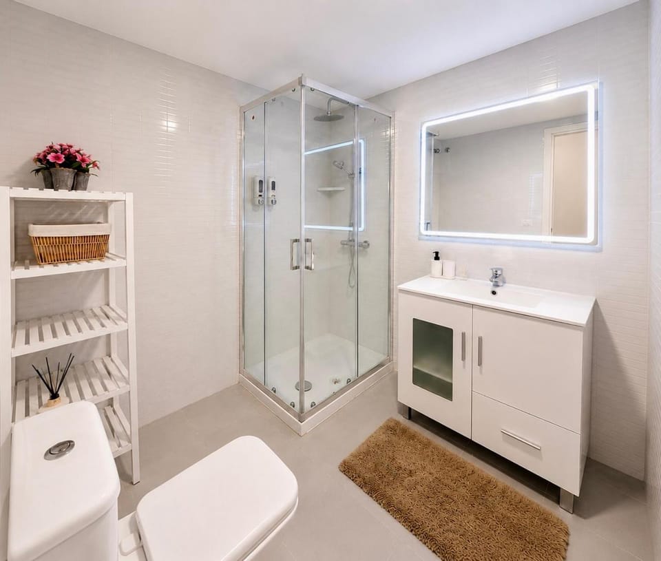 Shower, Toilet, Bathroom, hair dryier, towels