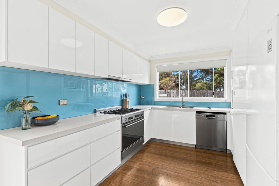 Kitchen or kitchenette, dishwasher, oven, stove