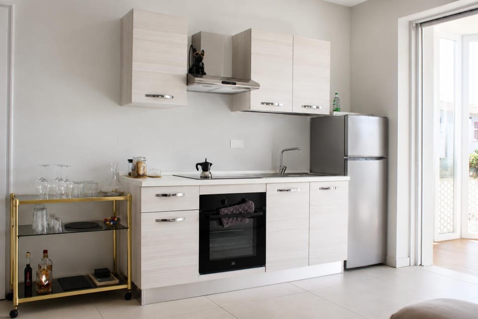 Kitchen or kitchenette, dishwasher, oven, stove