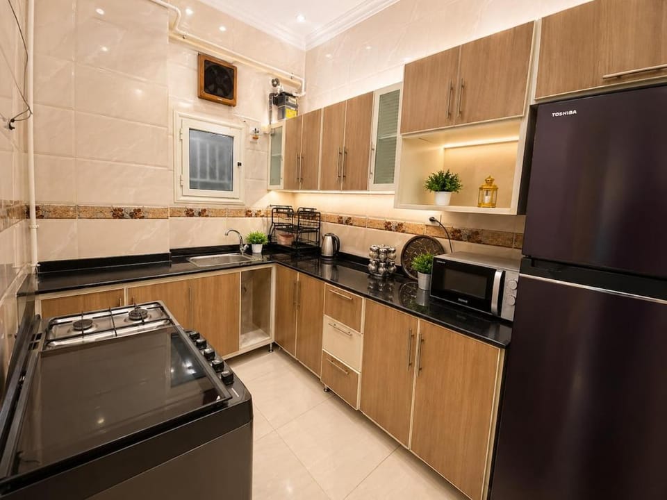 Kitchen or kitchenette, oven, stove, washing machine