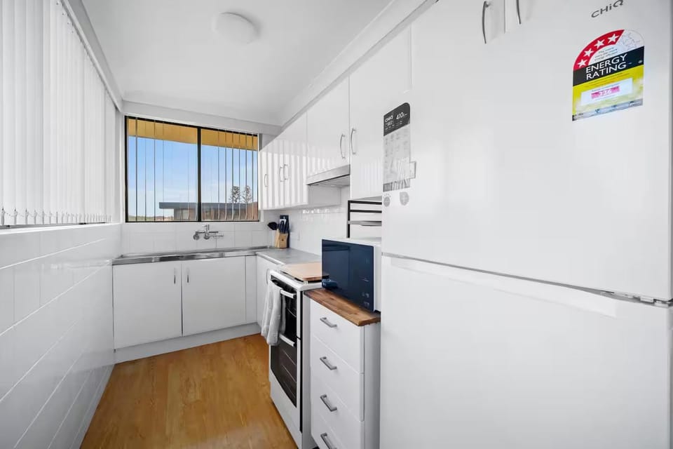 Kitchen or kitchenette, dishwasher, oven, stove