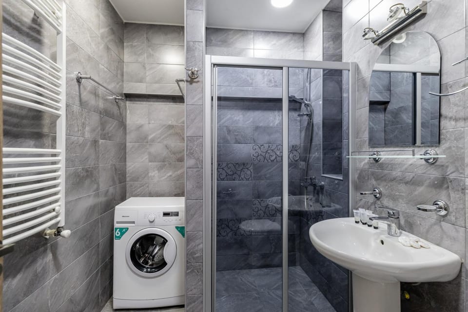 Shower, Toilet, Bathroom, towels, washing machine, dryer