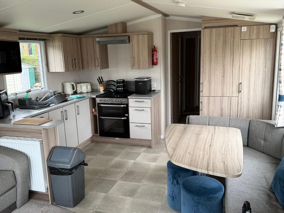 Kitchen or kitchenette, dishwasher, oven, stove, toaster