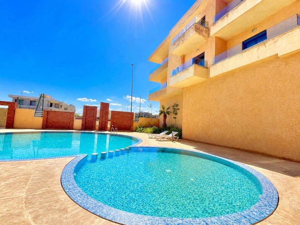 Patio, Day, Pool view, sunbed