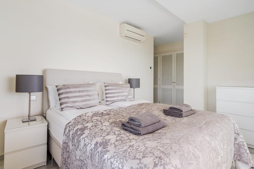 Bed, Bedroom, towels, wardrobe, air conditioner