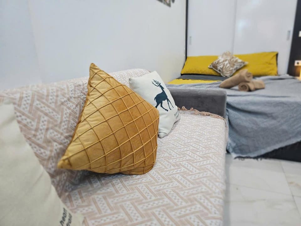 Bed, Living room, Seating area, Bedroom