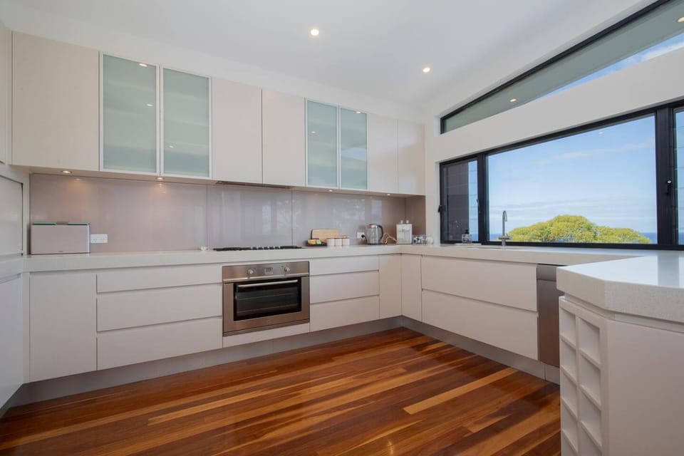 Kitchen or kitchenette, dishwasher, oven, stove