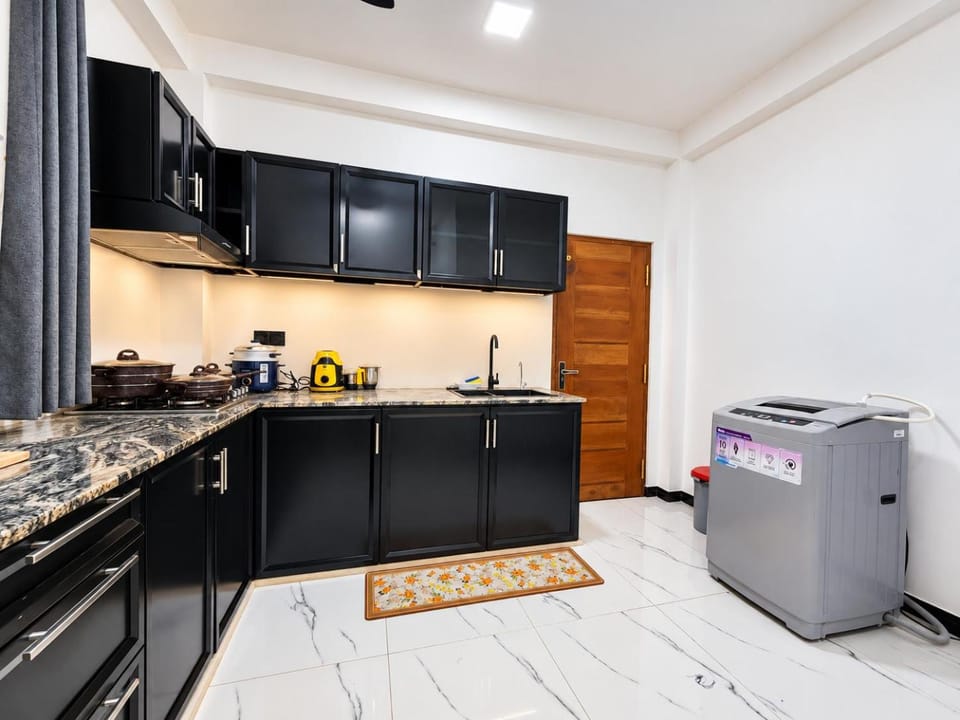 Kitchen or kitchenette, stove, washing machine