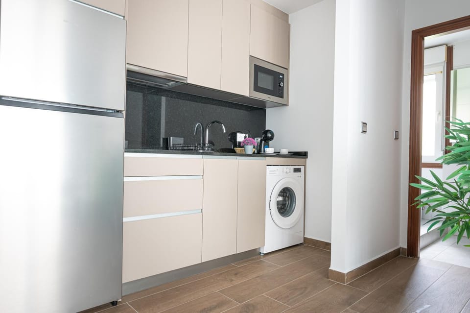 Kitchen or kitchenette, washing machine