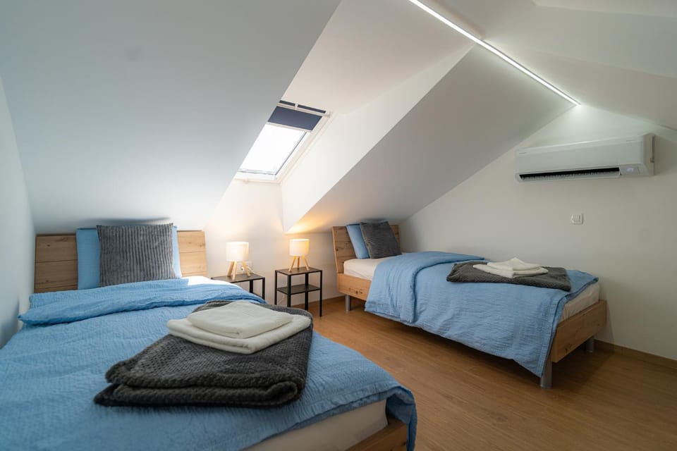 Bed, Photo of the whole room, Bedroom, towels, air conditioner
