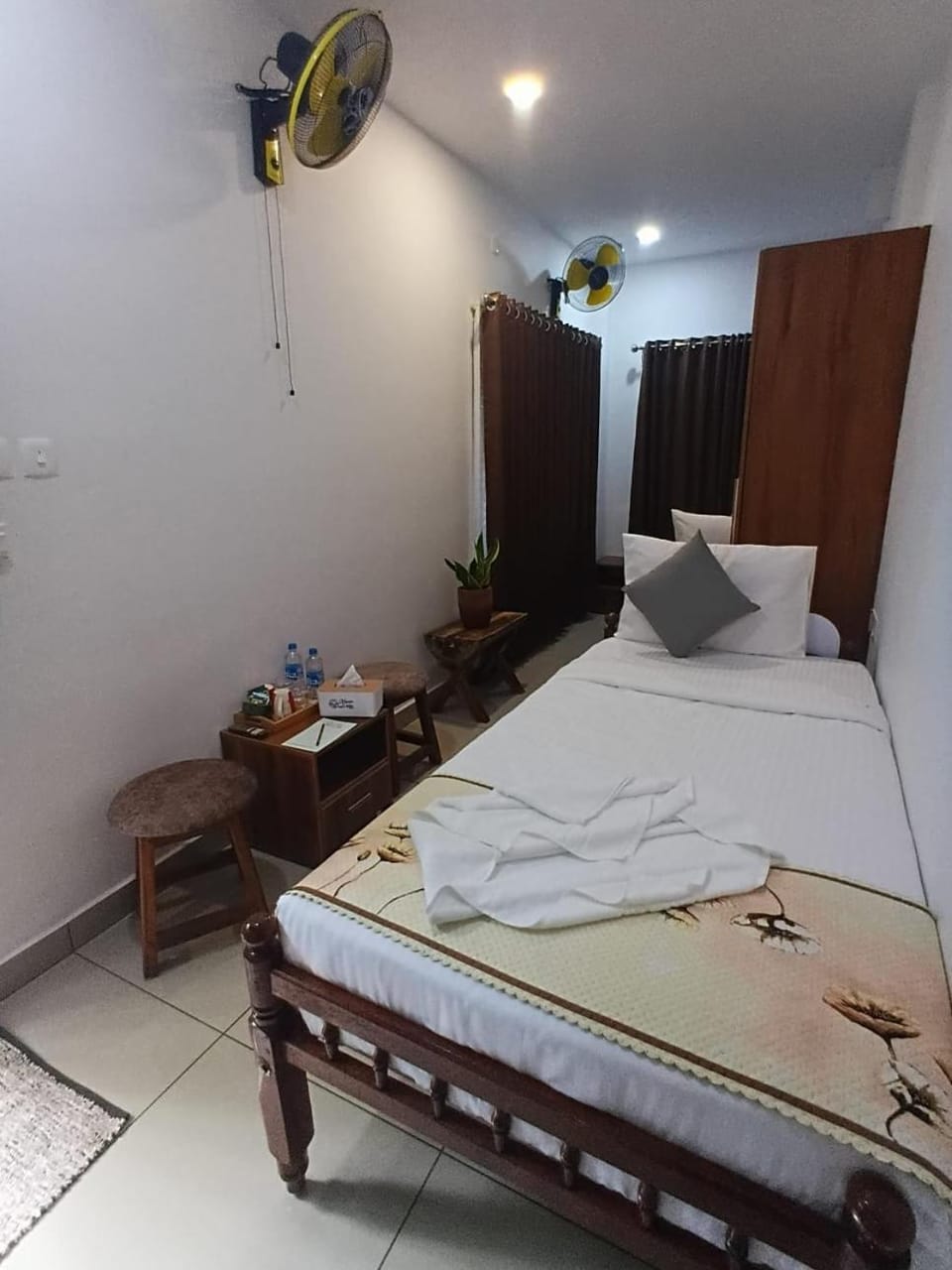 Bed, towels, wardrobe