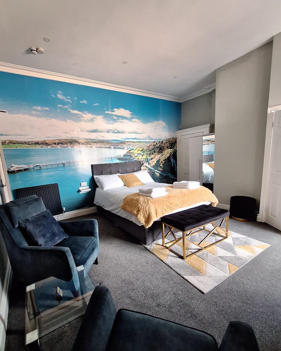 Bed, Living room, Seating area, Bedroom