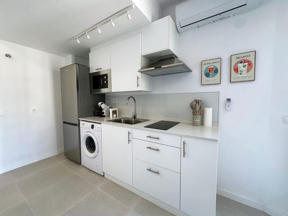 Kitchen or kitchenette, stove, air conditioner