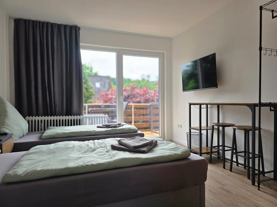 Bed, TV and multimedia, Balcony/Terrace, Photo of the whole room, Seating area, Bedroom, furniture, storage, towels
