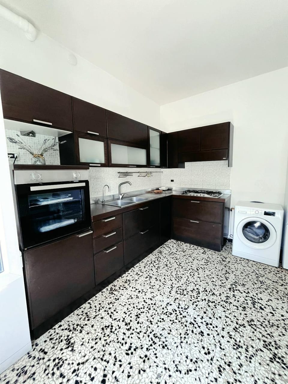 Kitchen or kitchenette, dishwasher, oven, stove, washing machine