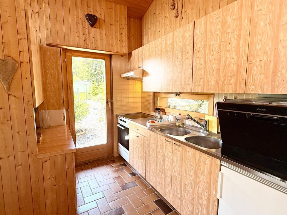 Kitchen or kitchenette, dishwasher, oven, stove