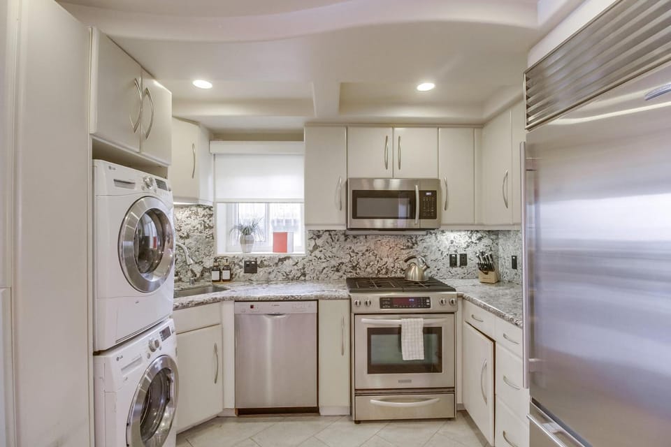Kitchen or kitchenette, dishwasher, oven, stove, toaster, washing machine, dryer
