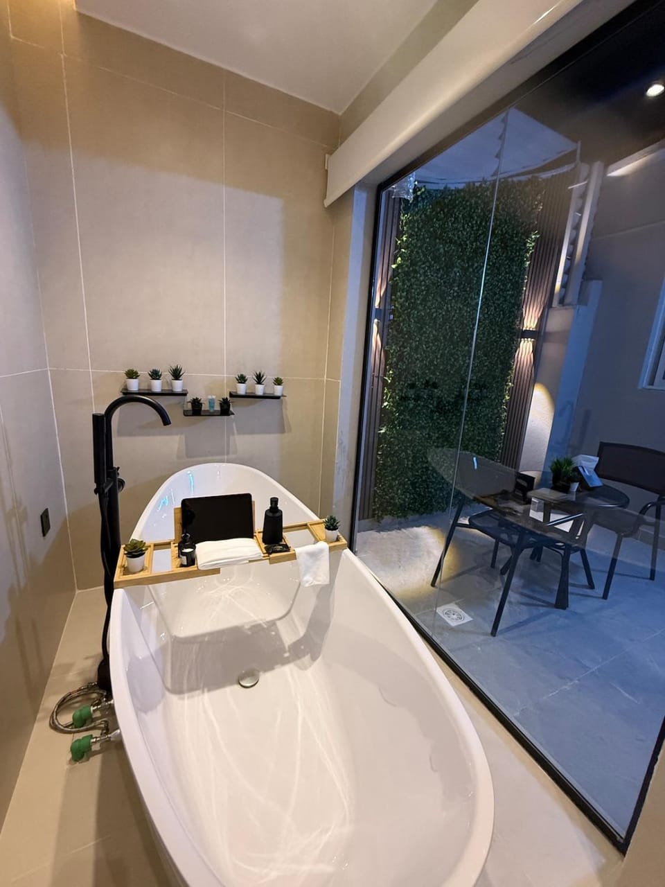 Cozy 1BR 65 inch TV Bathtub and Outdoor Seating Apartment in Riyadh