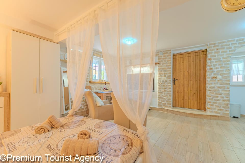Bed, towels, wardrobe