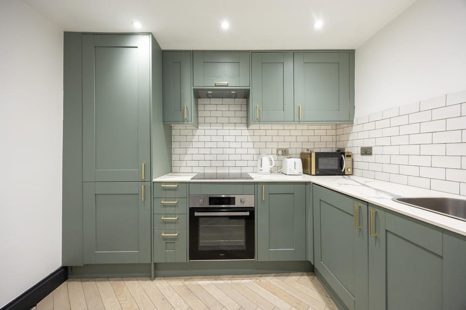 Kitchen or kitchenette, dishwasher, oven, stove, toaster