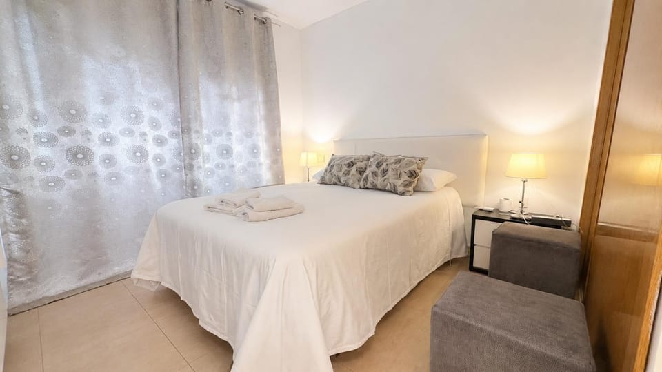 Bed, towels, wardrobe