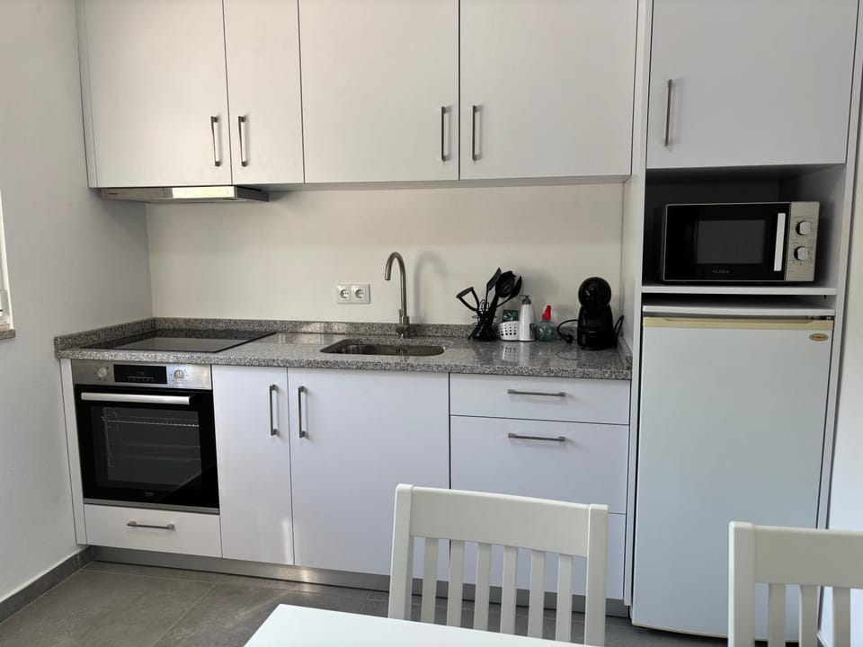 Kitchen or kitchenette, oven, stove