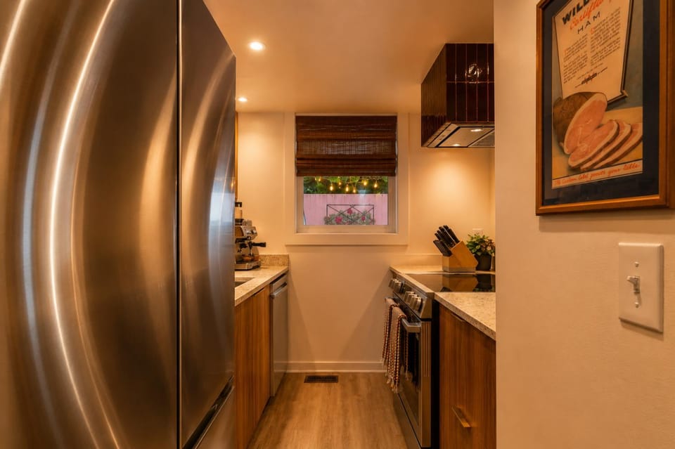 Kitchen or kitchenette, dishwasher, oven, stove