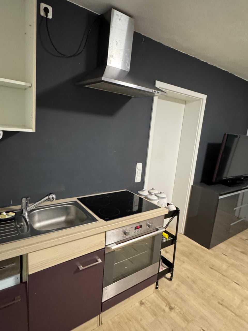 Kitchen or kitchenette, dishwasher, oven, stove