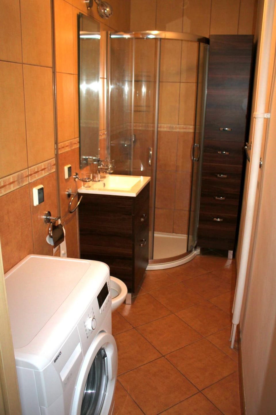 Shower, Toilet, Bathroom, towels, washing machine, dryer