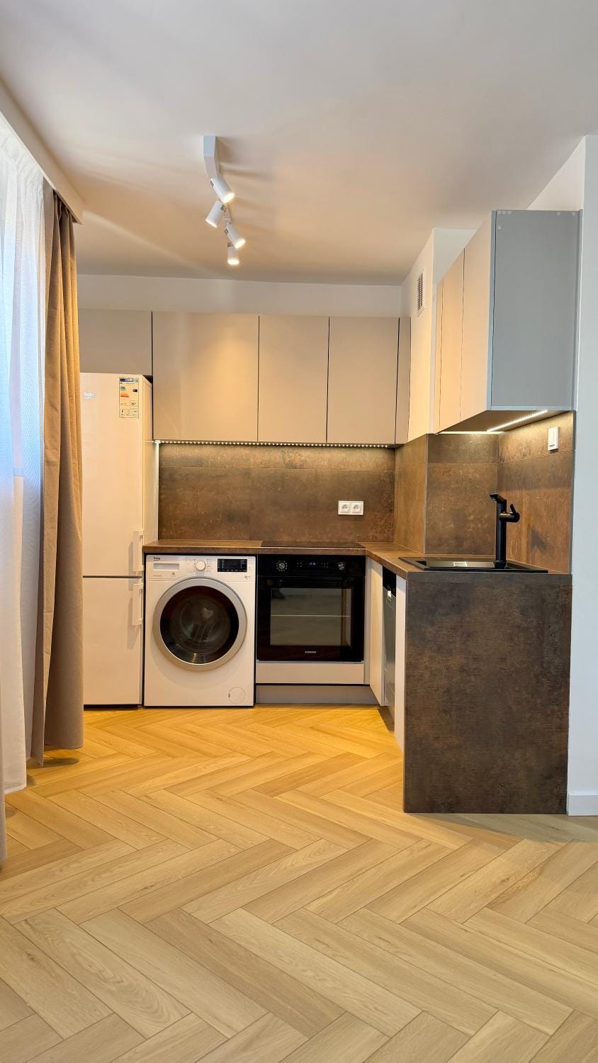 Kitchen or kitchenette, dishwasher, minibar, oven, stove, washing machine, dryer