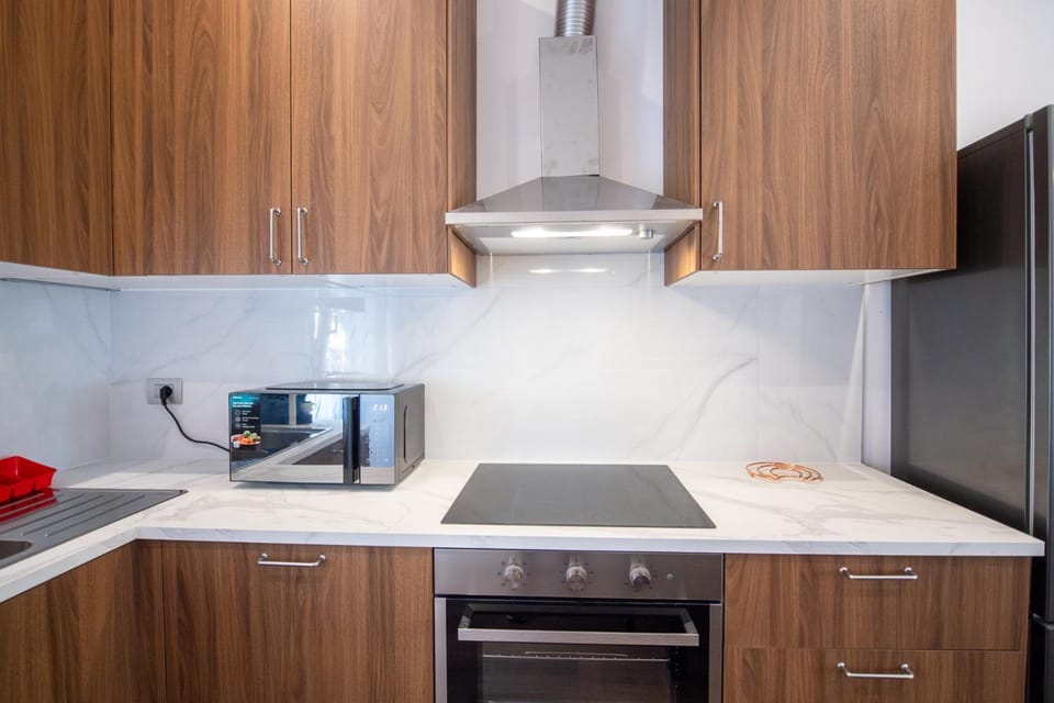 Kitchen or kitchenette, dishwasher, oven, stove