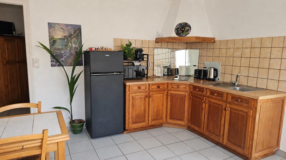 Kitchen or kitchenette, microwave, stove, toaster