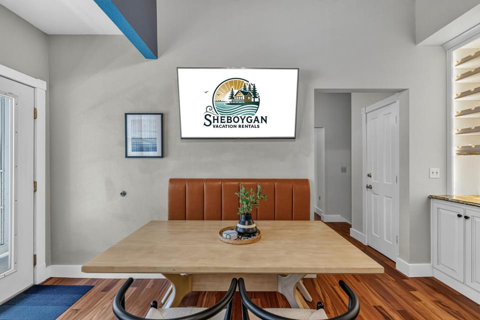 Property logo or sign, TV and multimedia, Seating area, Dining area, Text overlay