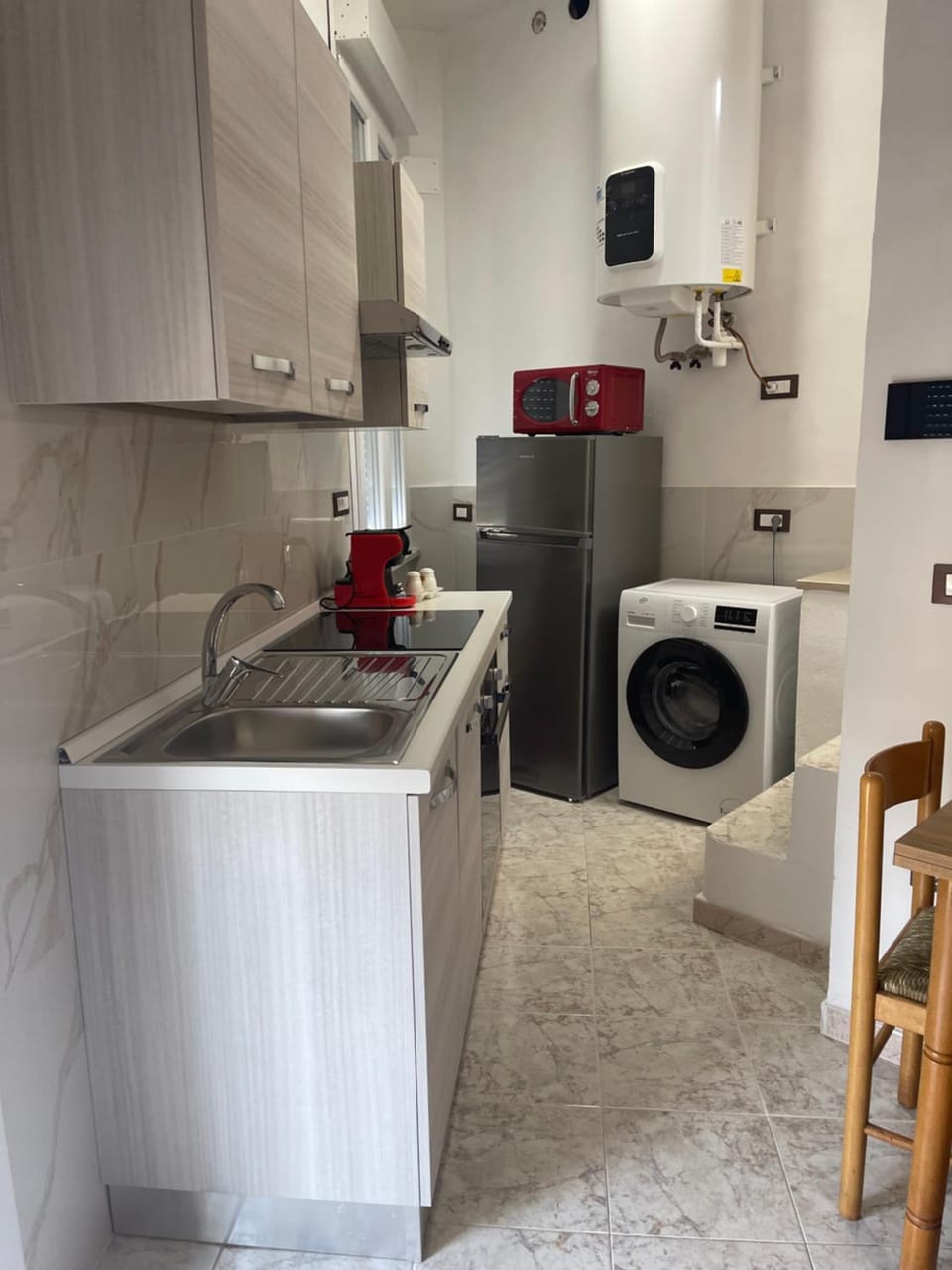 Kitchen or kitchenette, dishwasher, stove, washing machine