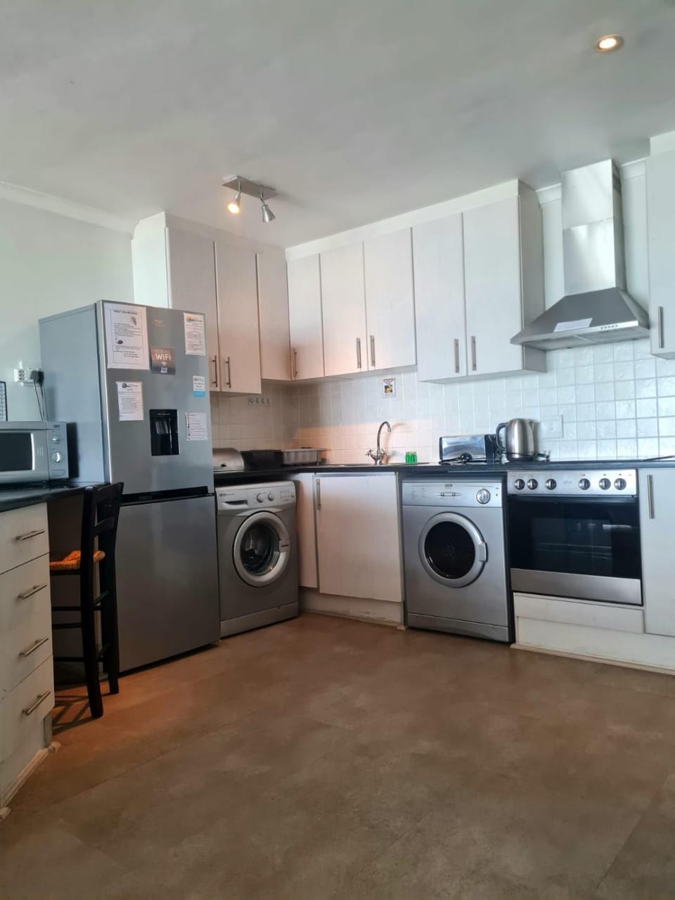 Kitchen or kitchenette, oven, stove, toaster, washing machine, dryer
