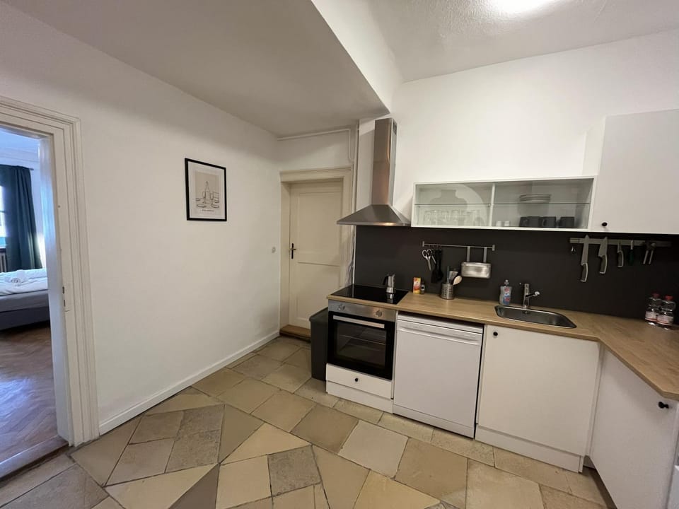 Kitchen or kitchenette, dishwasher, oven, stove