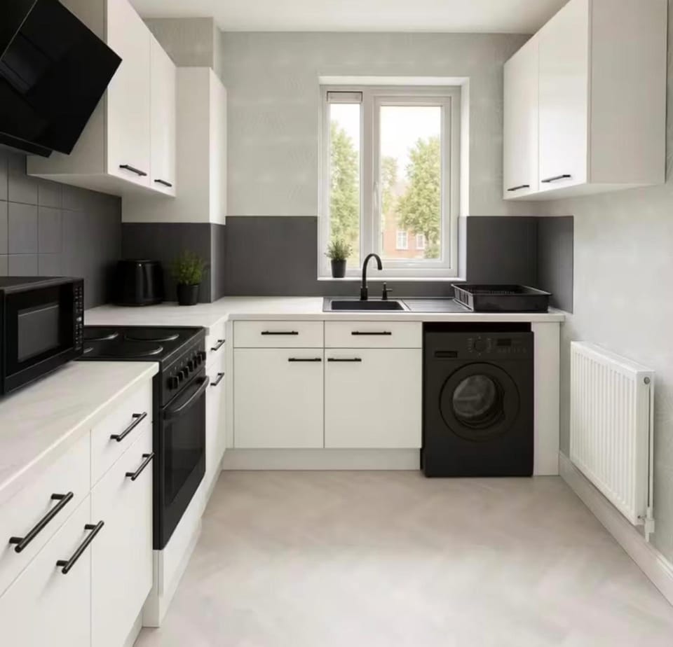 Kitchen or kitchenette, oven, stove, toaster, washing machine