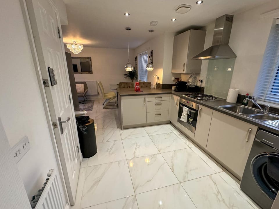 Kitchen or kitchenette, dishwasher, oven, stove, toaster
