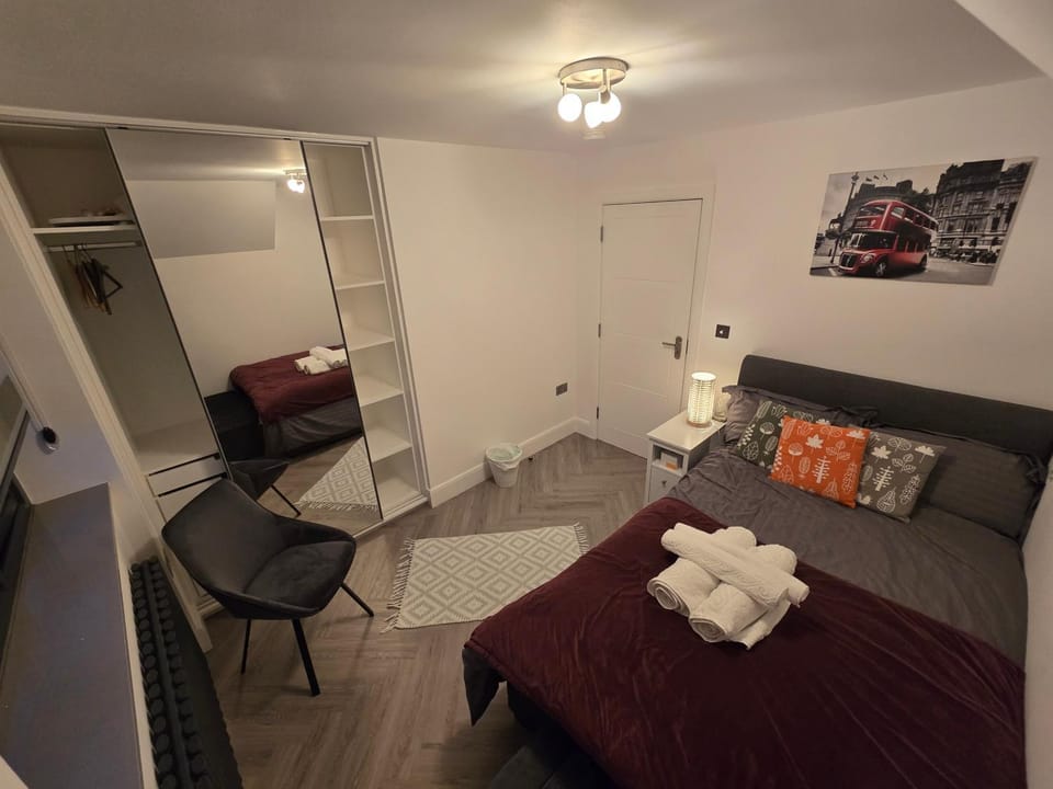 Bed, towels, wardrobe
