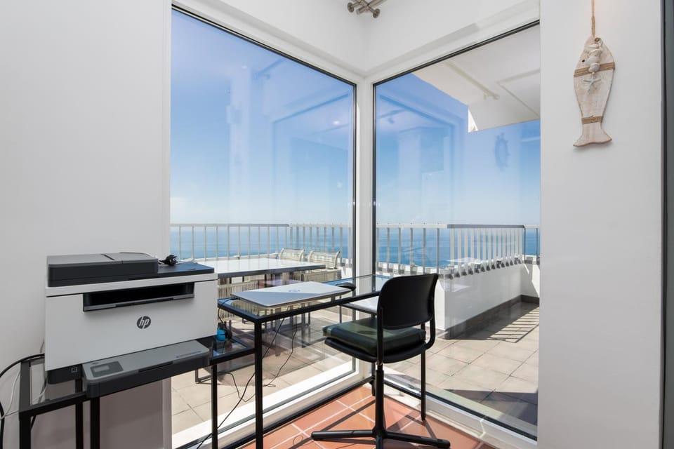 Natural landscape, View (from property/room), Living room, Seating area, Sea view