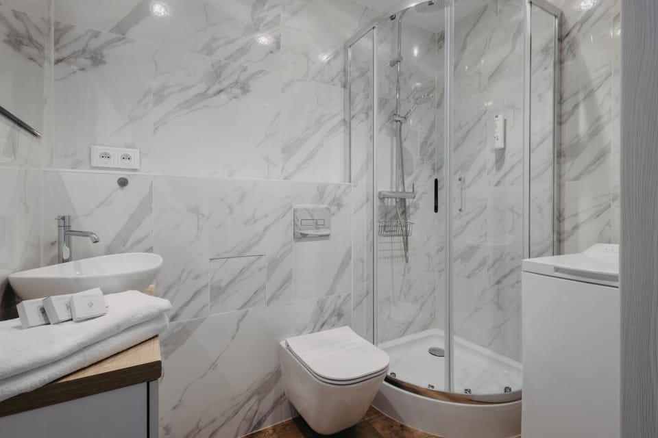 Shower, Toilet, Bathroom, towels, towels, washing machine, washing machine, washing machine
