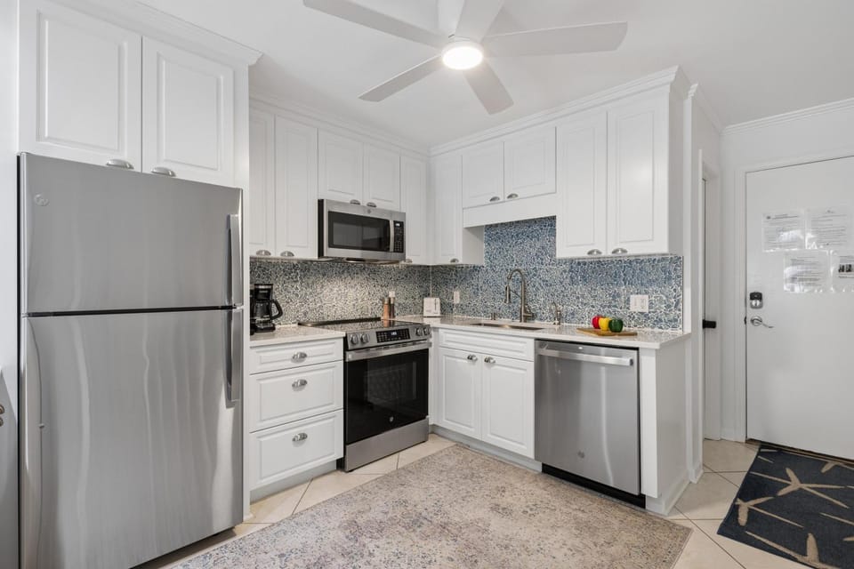 Kitchen or kitchenette, dishwasher, oven, stove, toaster