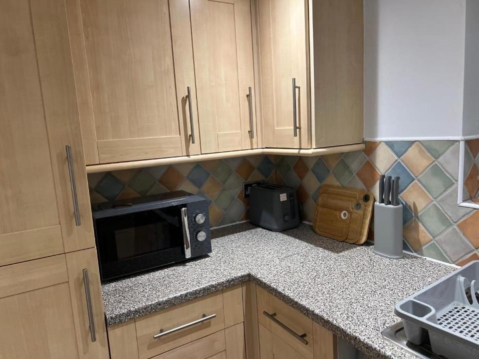 Kitchen or kitchenette, microwave, toaster