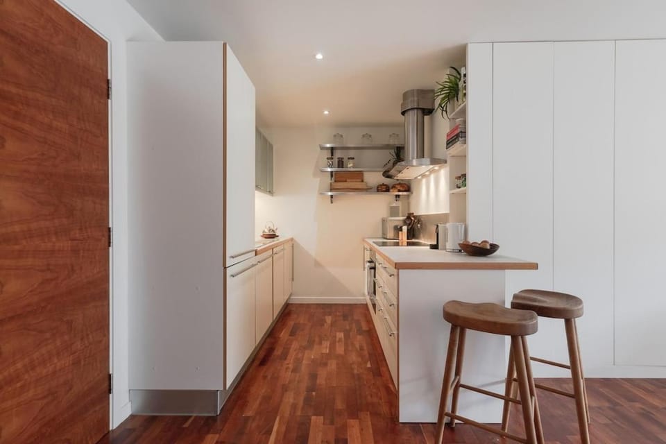Kitchen or kitchenette, dishwasher, oven, stove