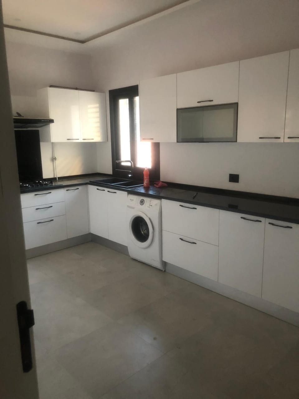 Kitchen or kitchenette, washing machine